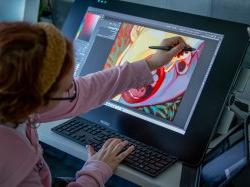 Header image of student working on a digital painting